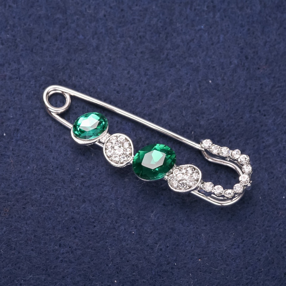 Mini brooch pin with white crystals, green stones, 50x15 mm, silver-colored metal
