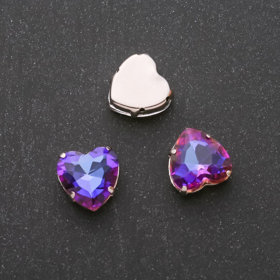 Price per pack / 10 pcs. Sew-on crystal in a heart-shaped prong setting 12mm blue-magenta