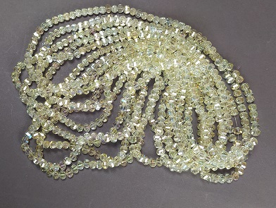 Crystal beads in Swarovski style, yellow transparent, faceted ball with petrol coating, diameter 5x4 mm, thread length 48 cm