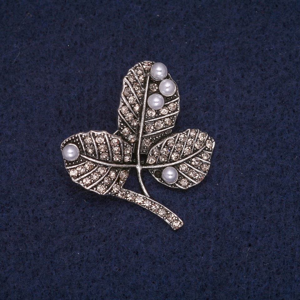 Brooch 'Leaves on a Branch' with beads and white rhinestones, gray metal 29×32mm