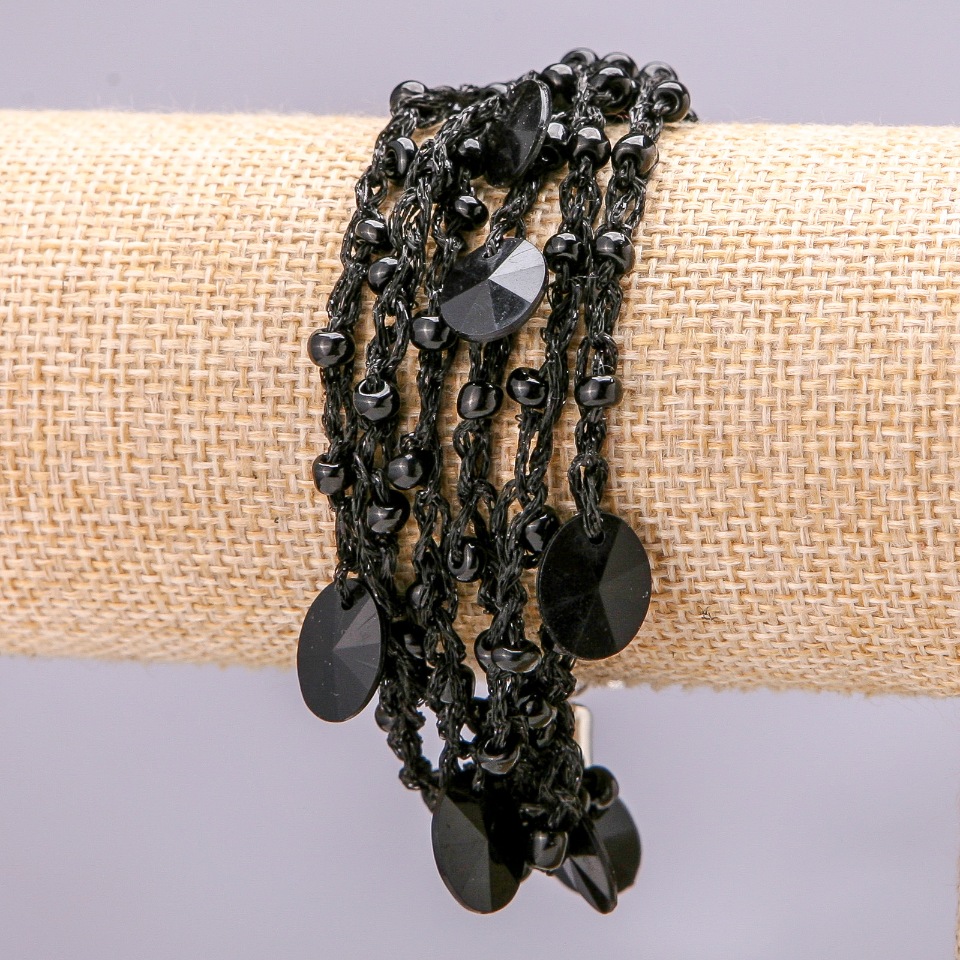 Bracelet with metal chain and carabiner clasp on macrame thread, black faceted round stones