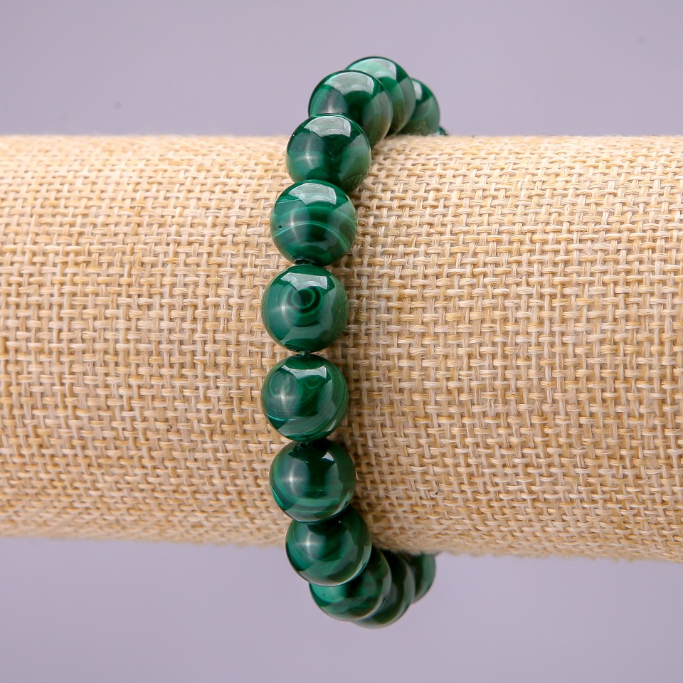 Bracelet made of natural malachite — smooth bead, diameter 10 mm (±), on elastic cord, length 18 cm