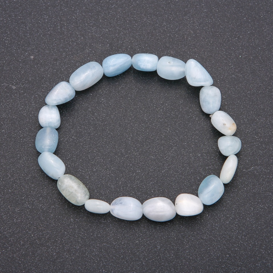 Bracelet made of natural aquamarine on elastic cord with guilloche, bead diameter 7x10(±)mm, circumference 18 cm