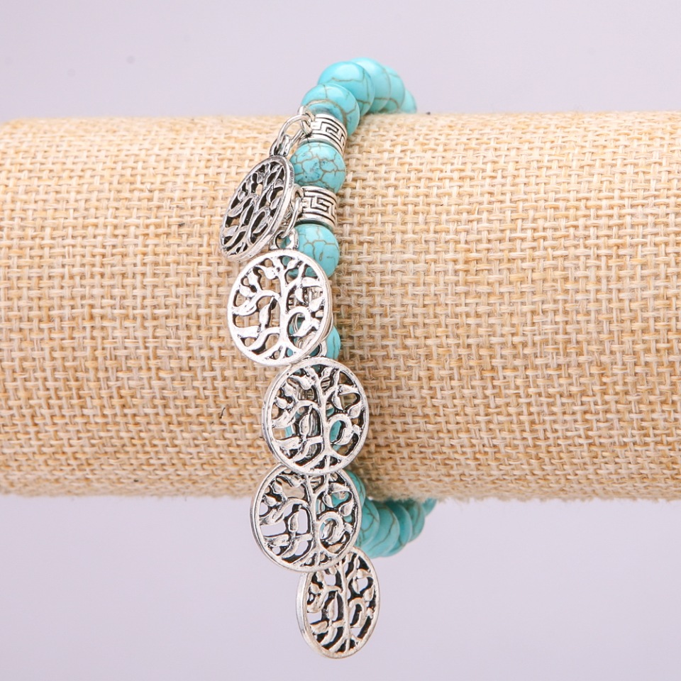 Turquoise bracelet on elastic, diameter 8(±)mm, length 18 cm with inserts and pendants