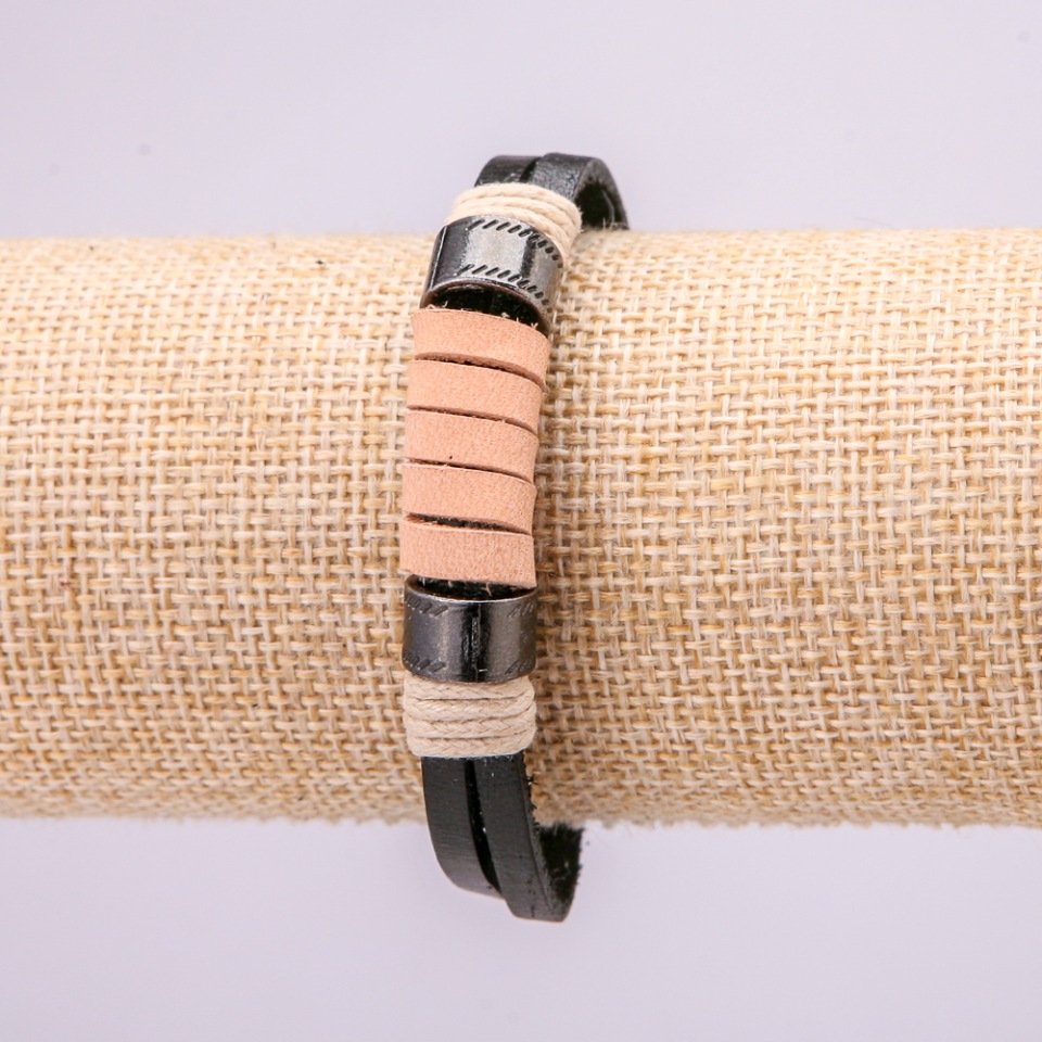 Bracelet with metal inserts, 21 cm long, 10 mm thick, eco leather, color black with brown