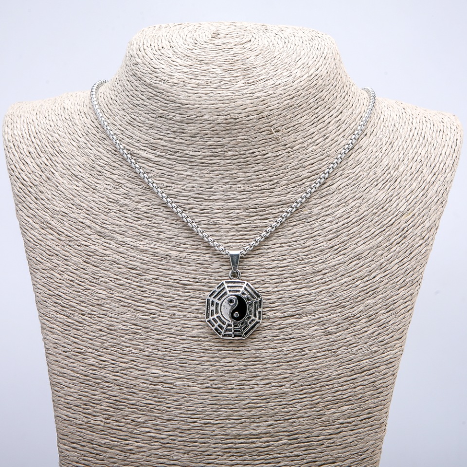 Pendant 'Yin Yang' 35×23 mm on a chain, length about 70 cm, silver-tone metal