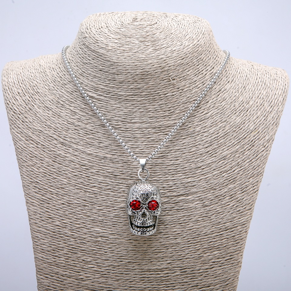 Pendant 'Skull' 50x23 mm on a chain, length about 70 cm, silver-colored metal
