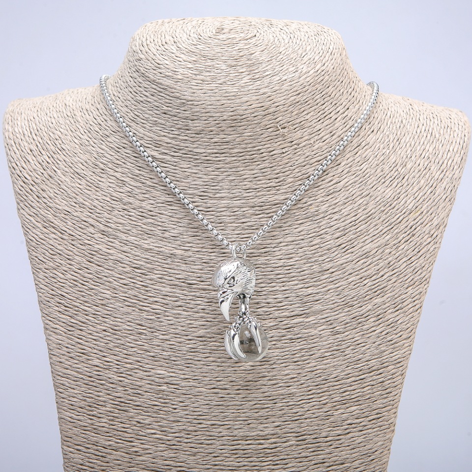 Pendant 'Bird with a Globe' 47x18 mm on a chain, length 70 cm, silver metal