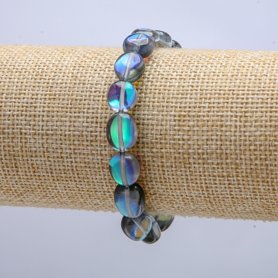 Elastic bracelet with opal glass 'Blue Chameleon' faceted bead, 10×7 mm, circumference 18 cm