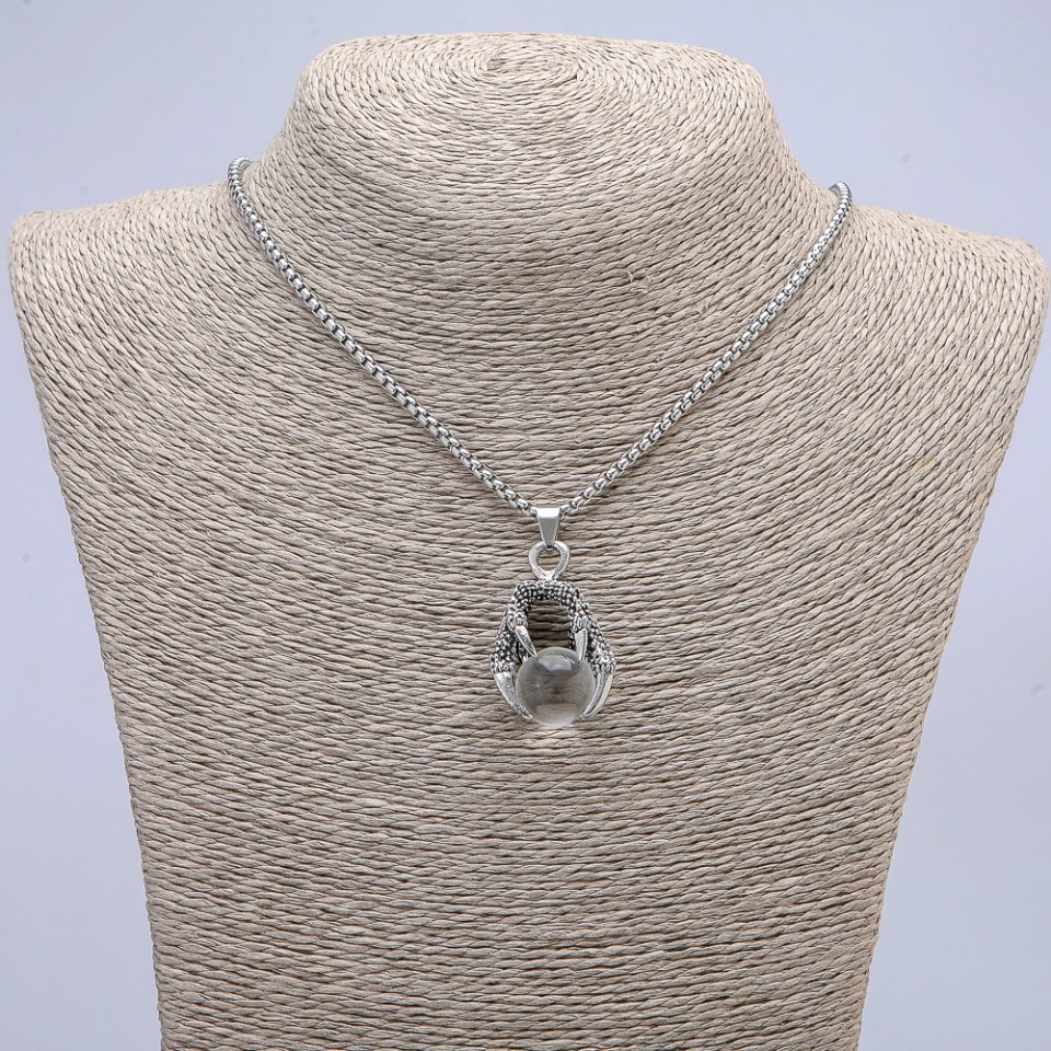 Pendant 'Ball in the Paw' 42x22 mm on a chain, chain length 70 cm +/- silver-colored metal