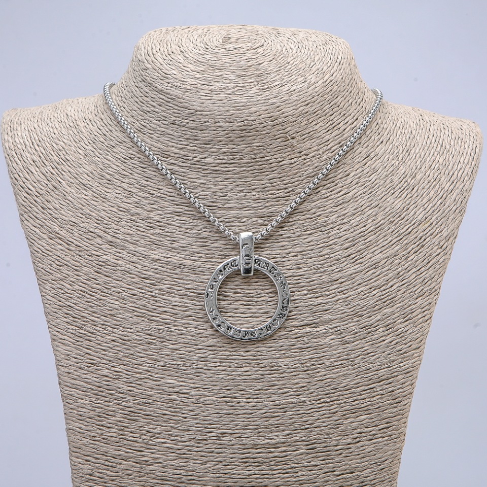 Pendant Circle with Hieroglyphs, 40x30 mm on a chain, length 65 cm, silver metal color