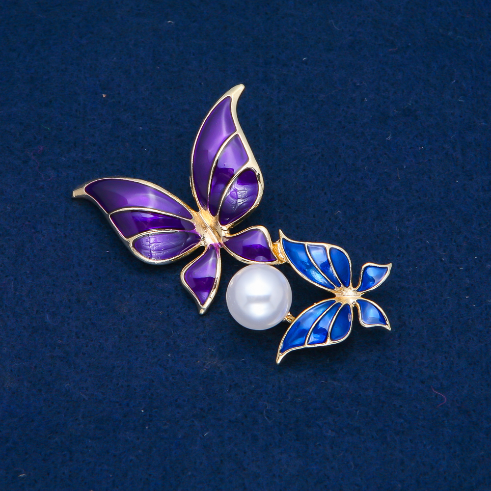 Brooch 'Butterflies' in golden metal, blue and purple enamel, white bead 65x38mm +