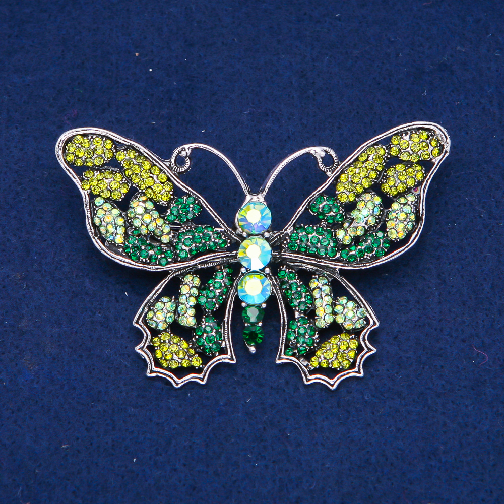 Butterfly Brooch in silvery metal, with green, lime, and gasoline crystals, 48×71 mm