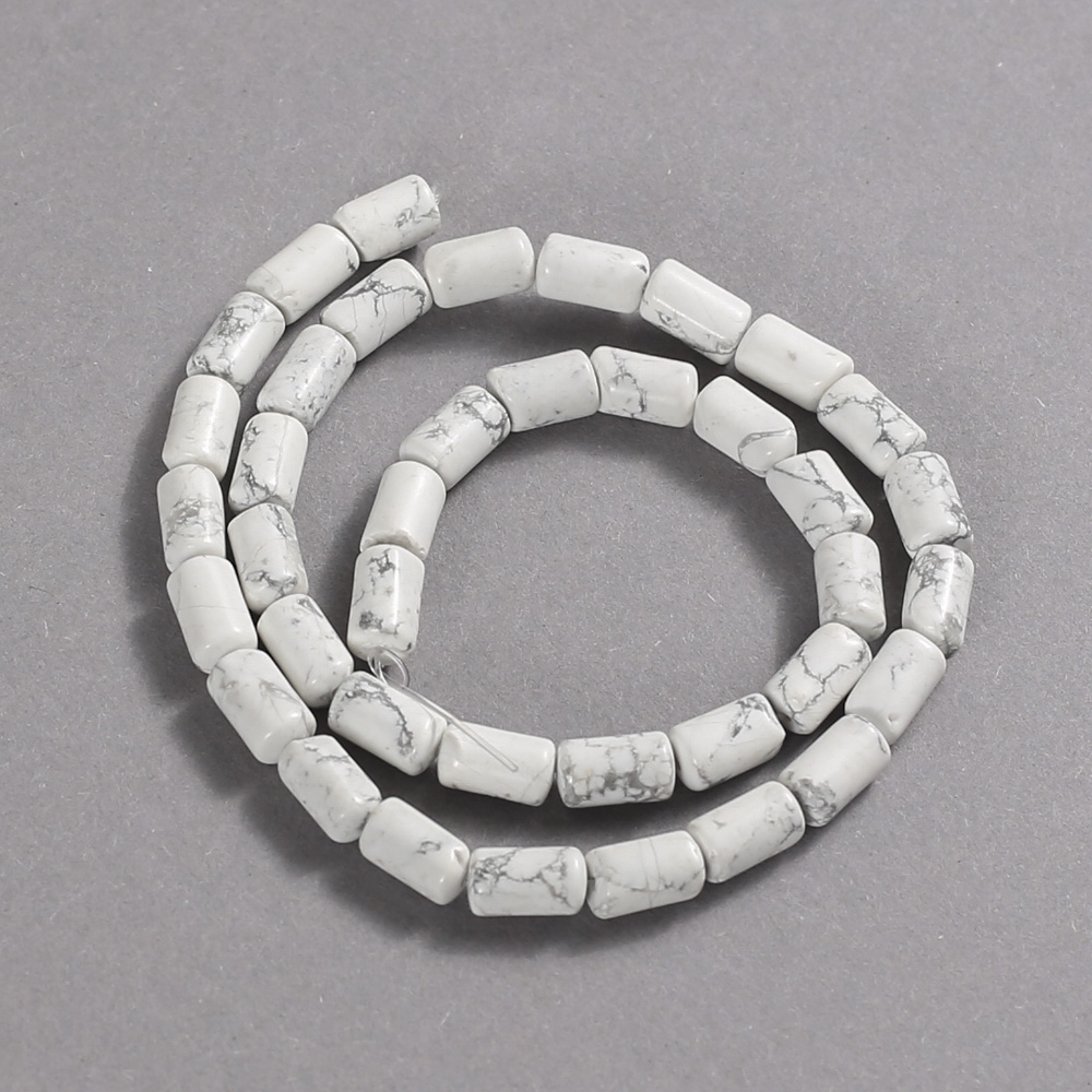 Beads on a string of natural howlite, smooth cylindrical, diameter 10x6 mm +/-, length 41 cm +