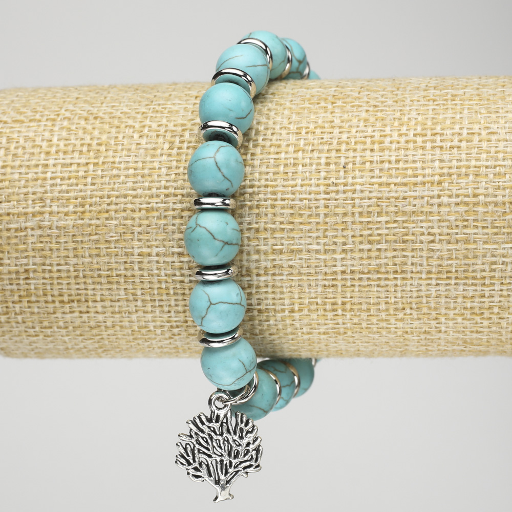 Turquoise bracelet (synthetic) on elastic, 10mm diameter ± with silver inserts and a pendant, length 18 cm+