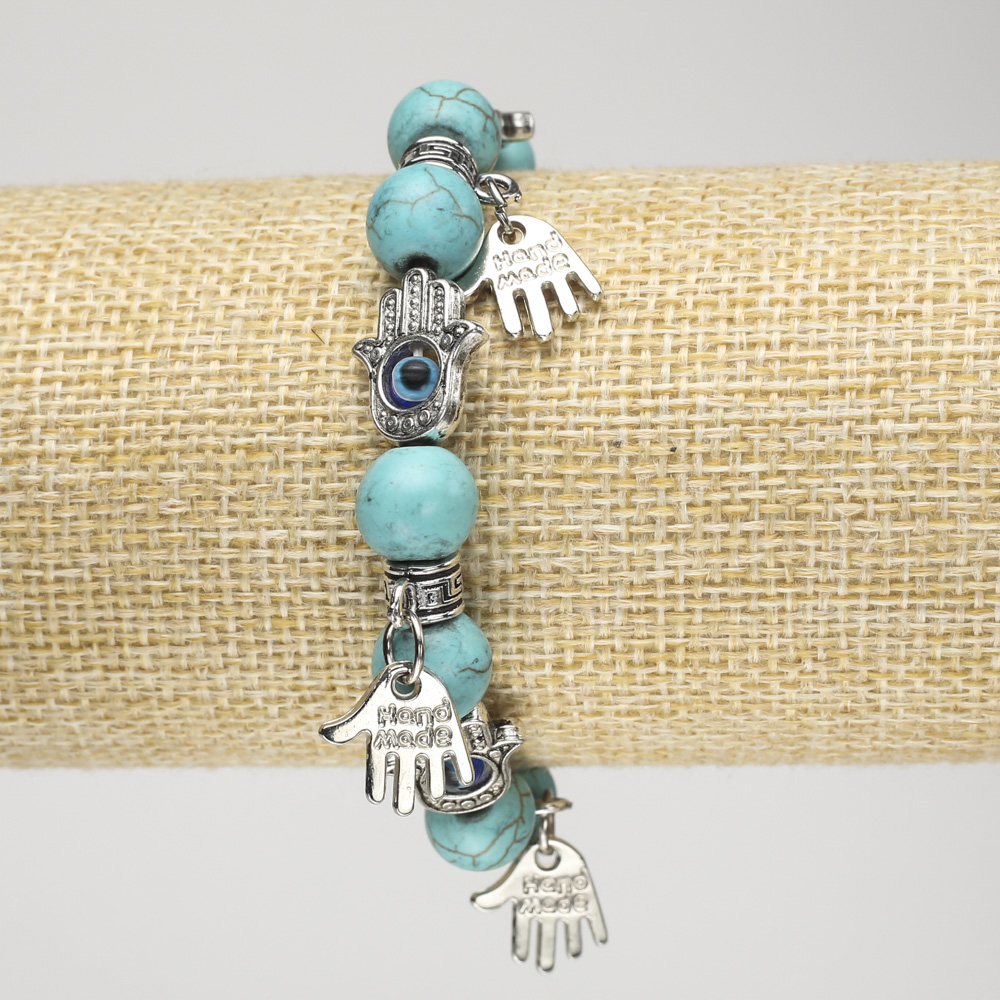 Turquoise bracelet (imitation) on elastic, 10 mm diameter ± with silver palm inserts and pendants, length 18 cm+