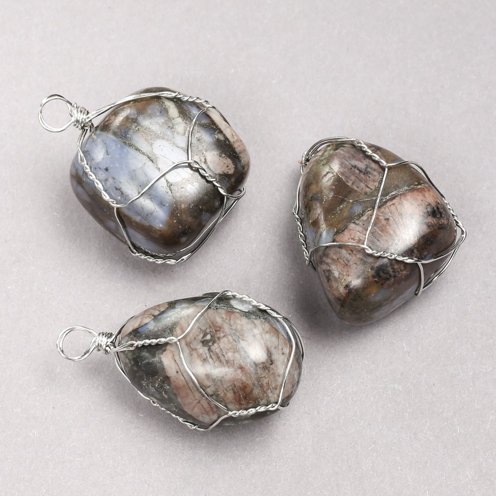 Pendant in a silver-woven setting with natural jasper, diameter 35x20 mm+