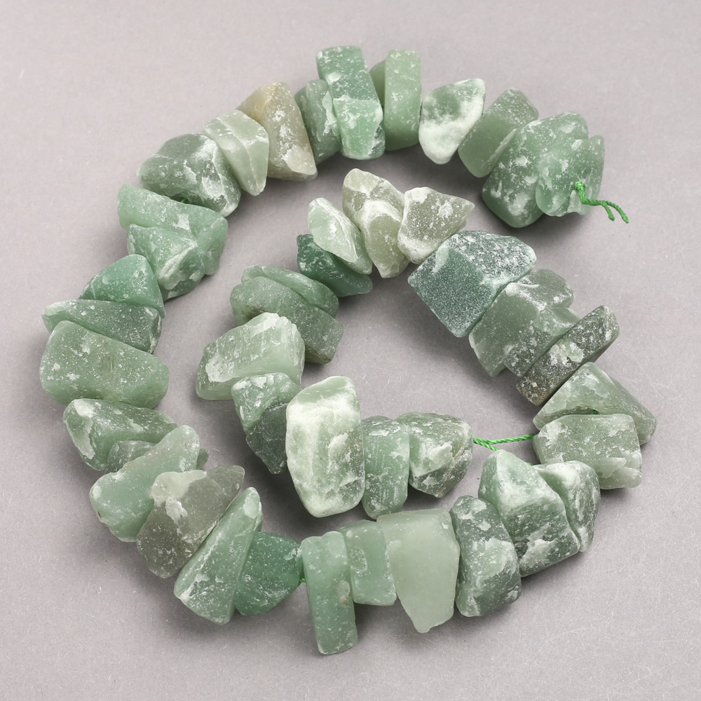 Beads of untreated jade on a thread, faceted, 10x20 mm, length 42 cm