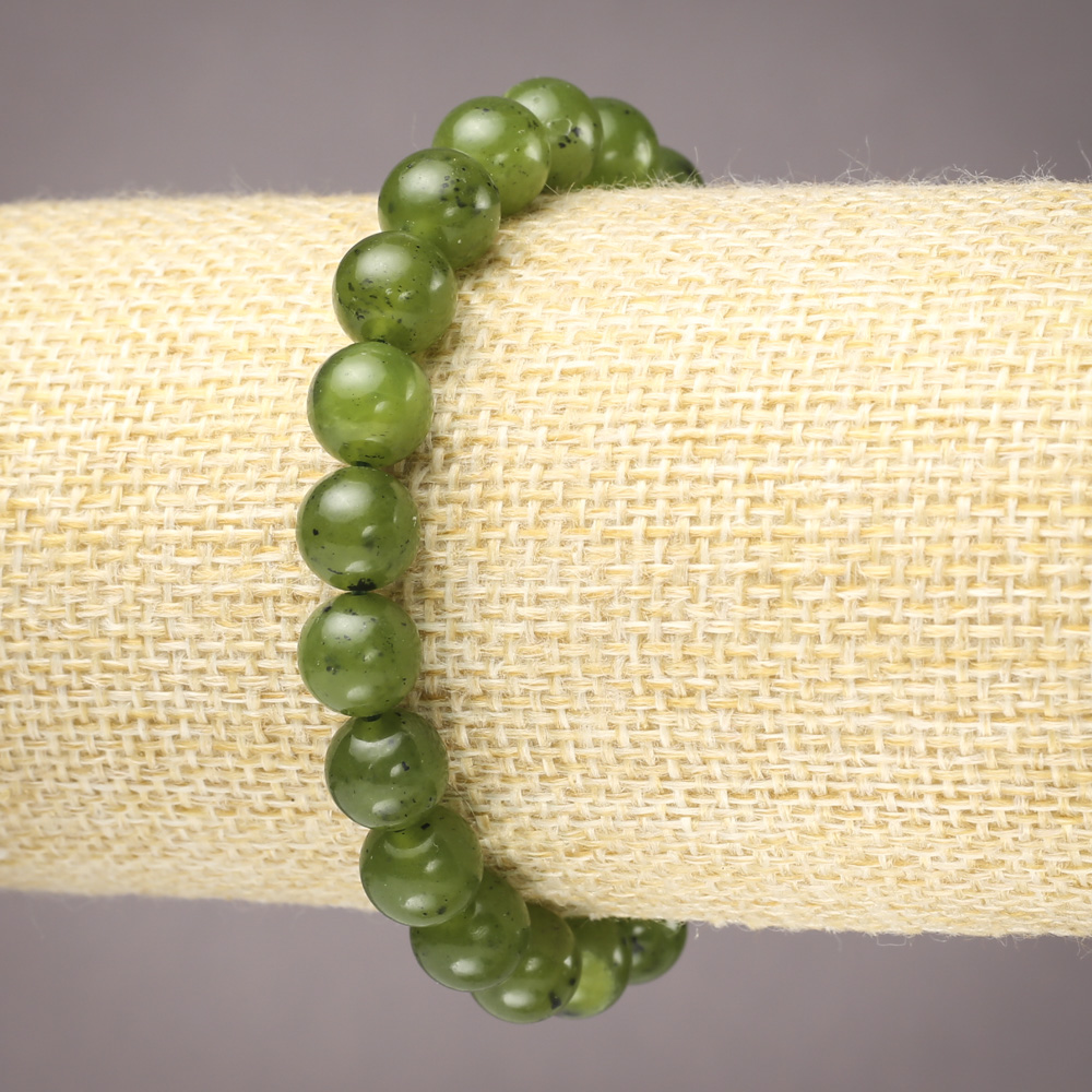 Elastic bracelet with natural stone Canadian Jadeite, smooth beads, 8 mm diameter+
