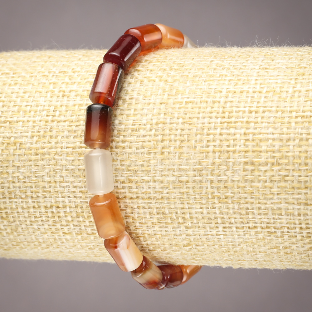 Elastic bracelet with natural carnelian, smooth cylindrical beads, diameter 10x6 mm