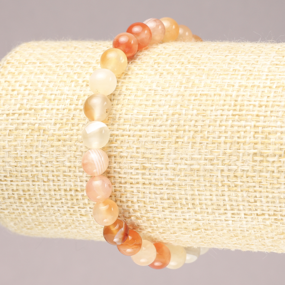 Elastic bracelet with natural orange agate, smooth bead, diameter 6.5 mm+