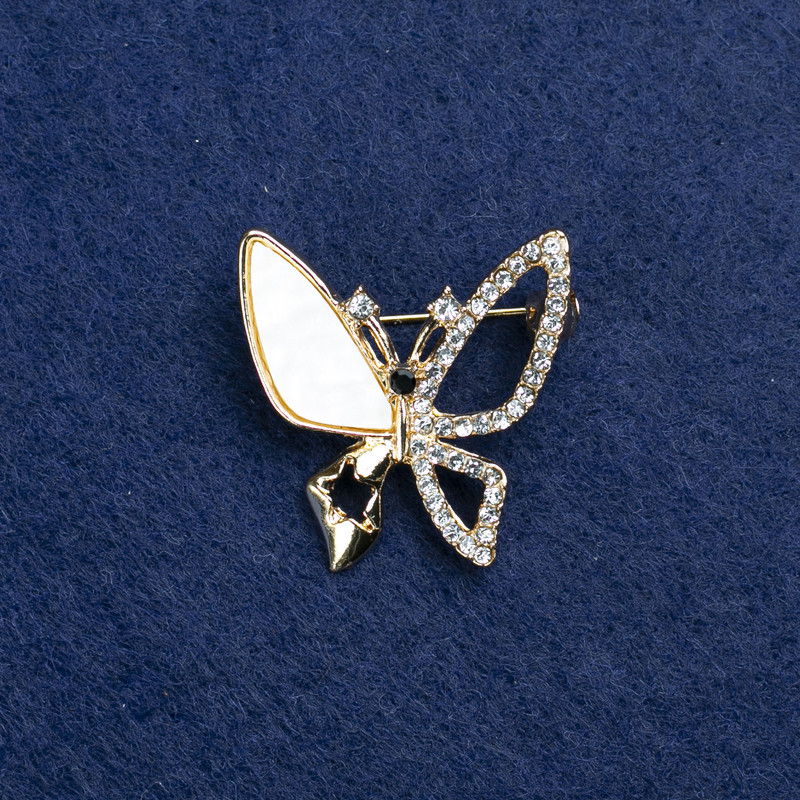 Brooch 'Butterfly' in golden metal, with mother-of-pearl and crystals, 27mm+
