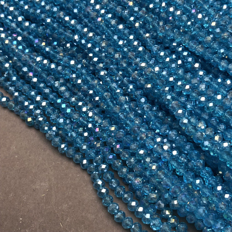 Намистини Чеський Кришталь на волосіні синьо-зелене прозоре з бензином гранований рондель, діаметр 3, 5х3мм + -, довжина 36-38см +