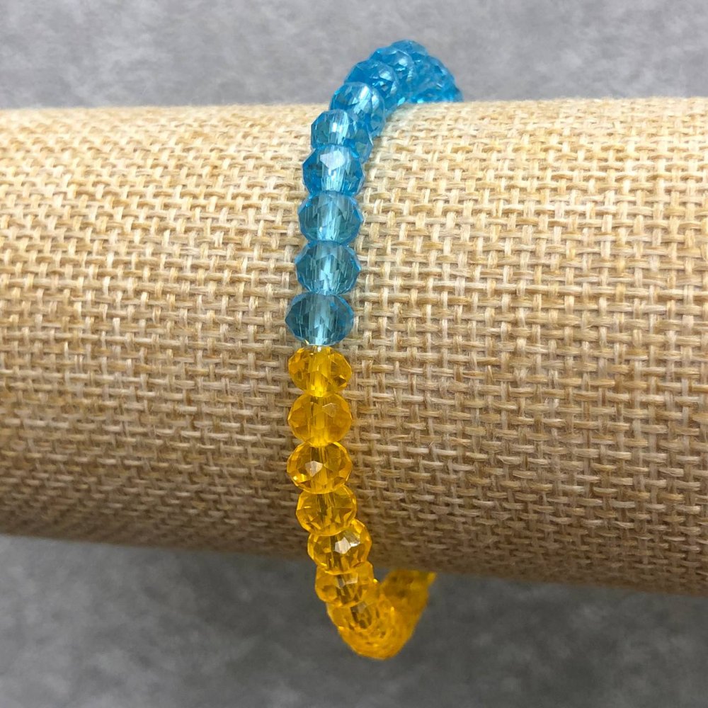 Elastic bracelet with Czech crystal 'Ukraine' faceted rondel, diameter 6x4 mm, length 18 cm