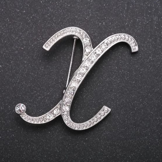 Initial X brooch with white crystals, gray metal finish, 43x38 mm