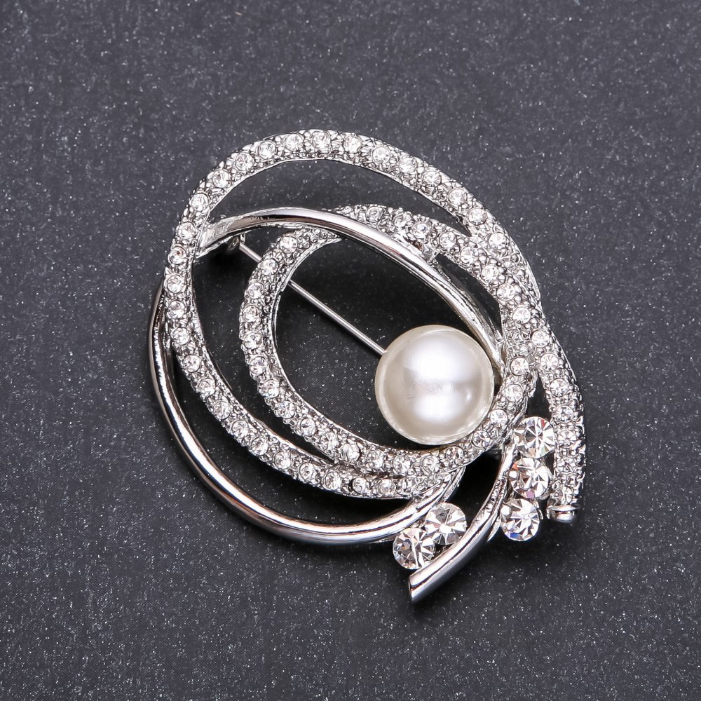Pearl brooch in white-silver metal color 57 x 30 mm