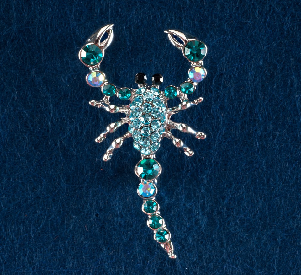 Brooch 'Scorpion' with turquoise-blue rhinestones, gray metal, 55×25 mm