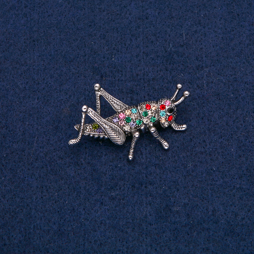 Brooch 'Grasshopper' silver-colored metal with multicolored crystals 42x26mm +
