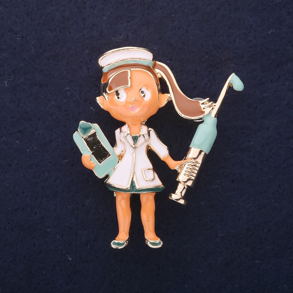 Brooch 'Doctor' enamel white and blue, 45x35mm, gold-tone metal