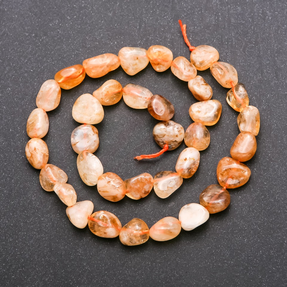 Citrine beads on a faceted thread, 9×13 mm diameter, length 38 cm