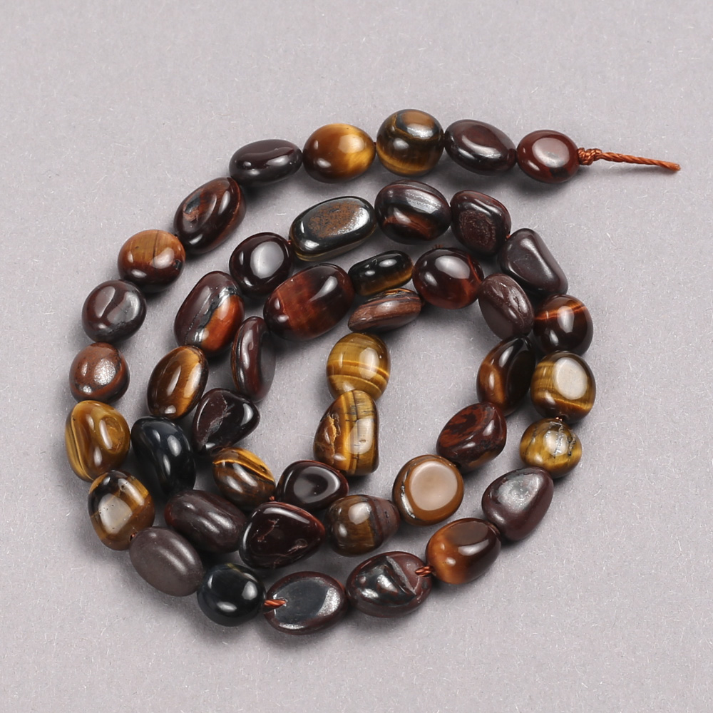 Beads on thread of natural Bull's Eye, Hawk's Eye, and Tiger's Eye – soft-faceted, 6x8 mm, length 39 cm +