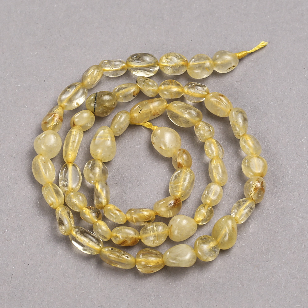 Beads on a thread of natural Rutile Quartz, faceted, diameter 8x6 mm + -, length 39 cm +