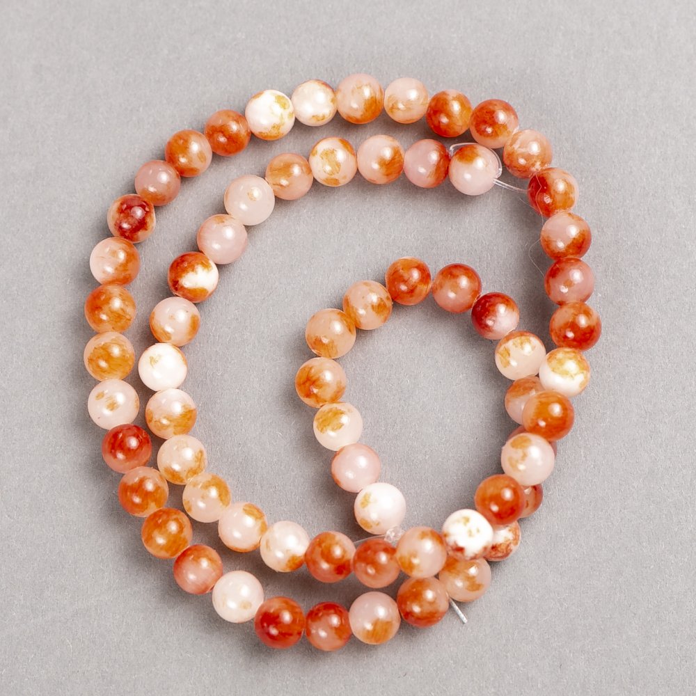 Beads white semi-transparent brownish 'Carnelian' (synthetic acrylic) on a beading thread, smooth spheres, 6mm diameter, 40 cm length