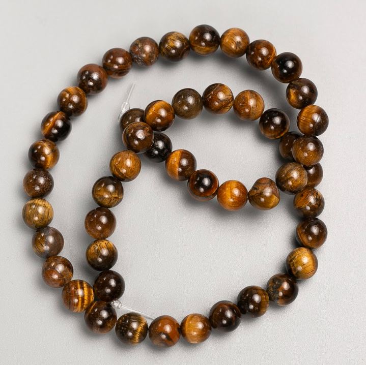 Beads on beading wire made from natural Tiger's Eye stone, 8 mm diameter, 37 cm length