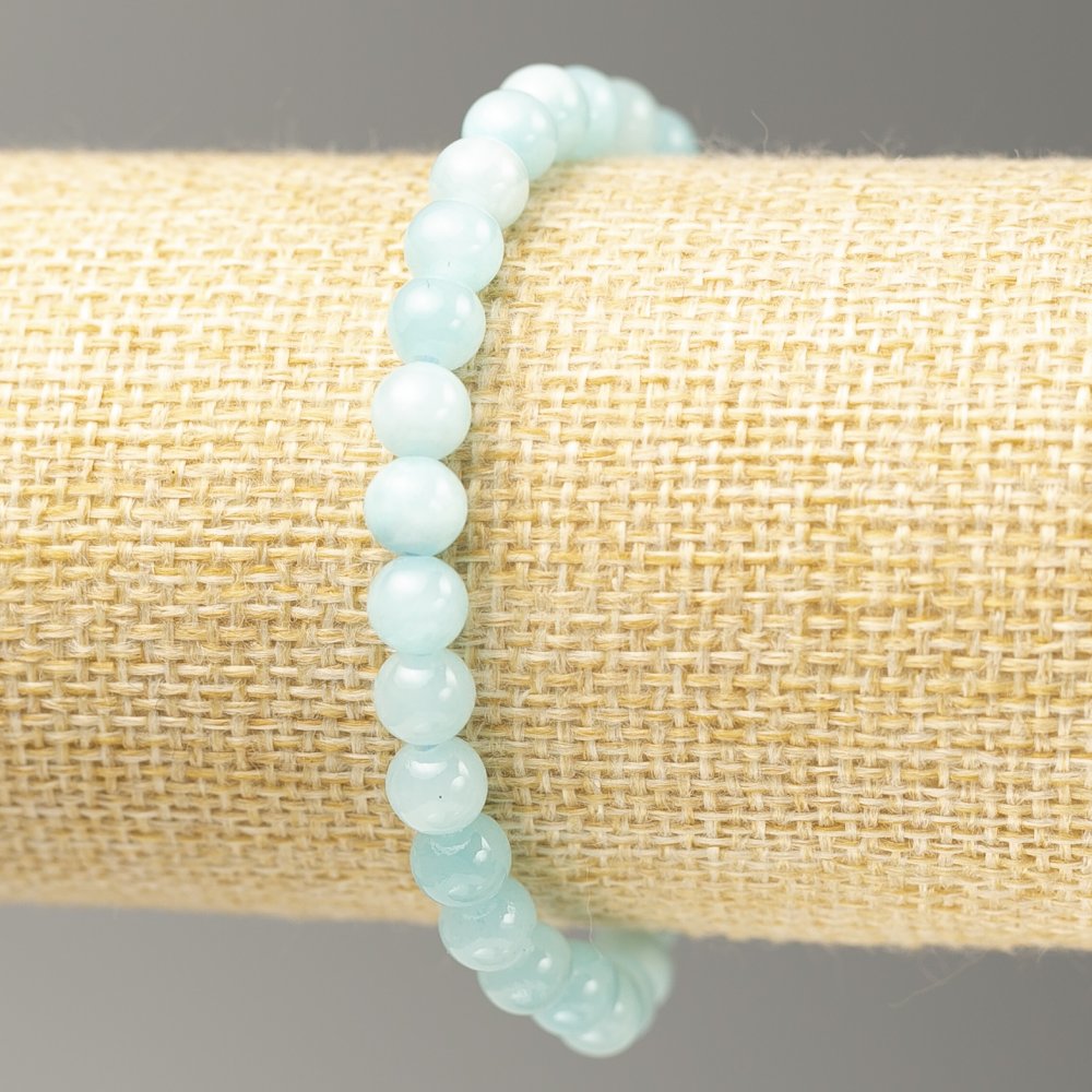 Aquamarine imitation bracelet on elastic cord, smooth bead, 6.5 mm diameter, 18 cm length
