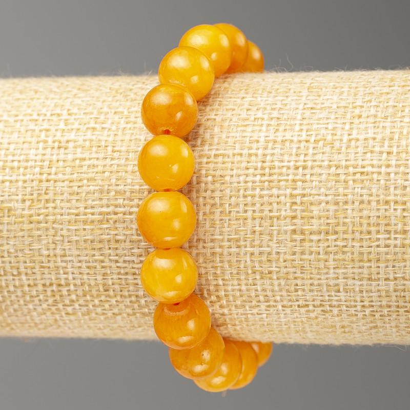 Elastic bracelet with imitation amber, smooth beads, 10 mm diameter, 18 cm length