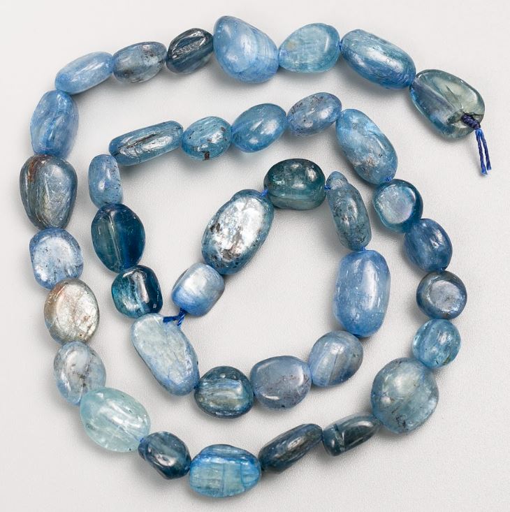 Beads on a thread of natural kyanite, tumbled, 10×12 mm, length 40 cm +/-