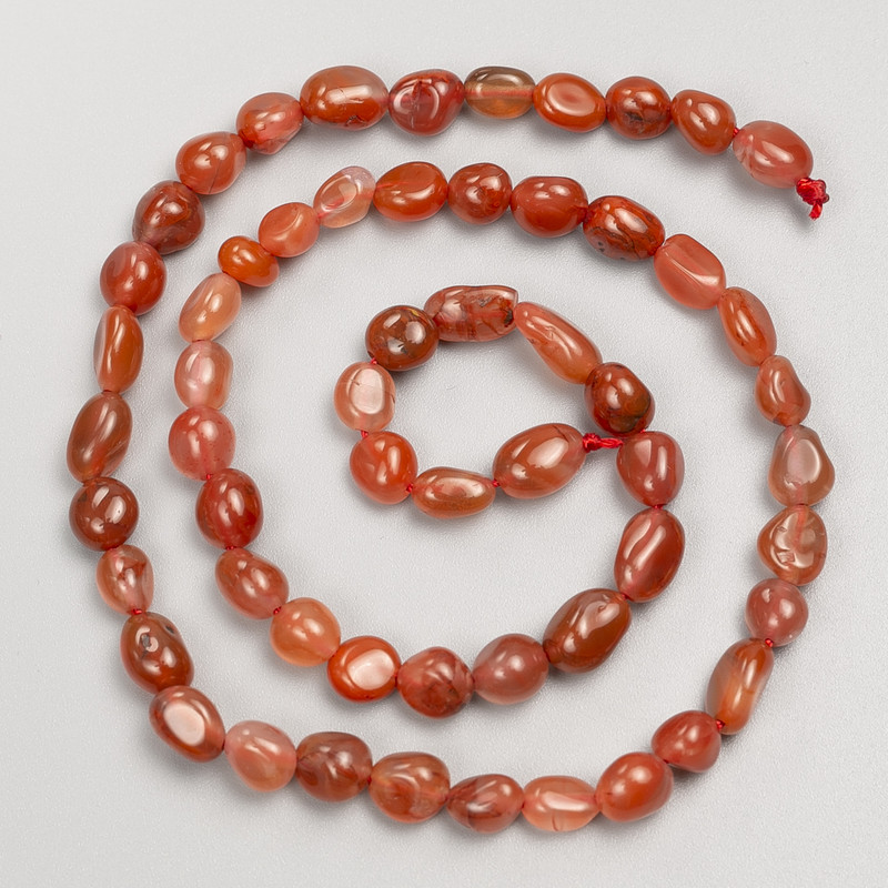 Carnelian beads, faceted on thread, diameter 6x7 mm, length 40 cm