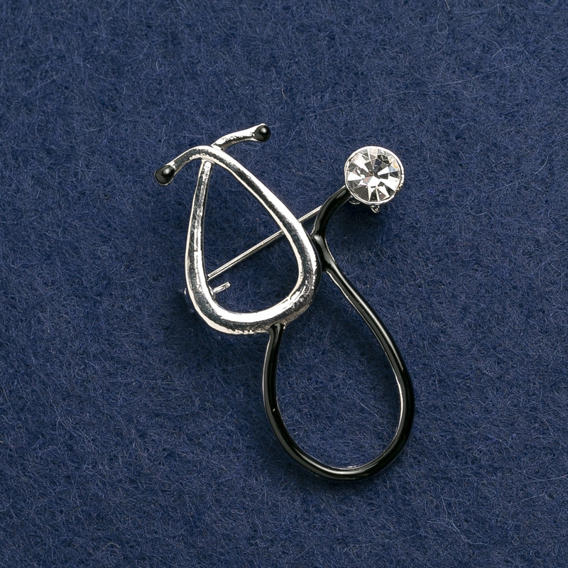 Brooch 'Stethoscope' enamel black with white stone, silver metal 44×29 mm