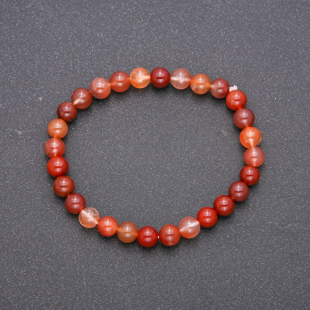 Bracelet made of natural red rutile quartz on elastic cord, smooth beads, diameter 6(±)mm, length 18cm