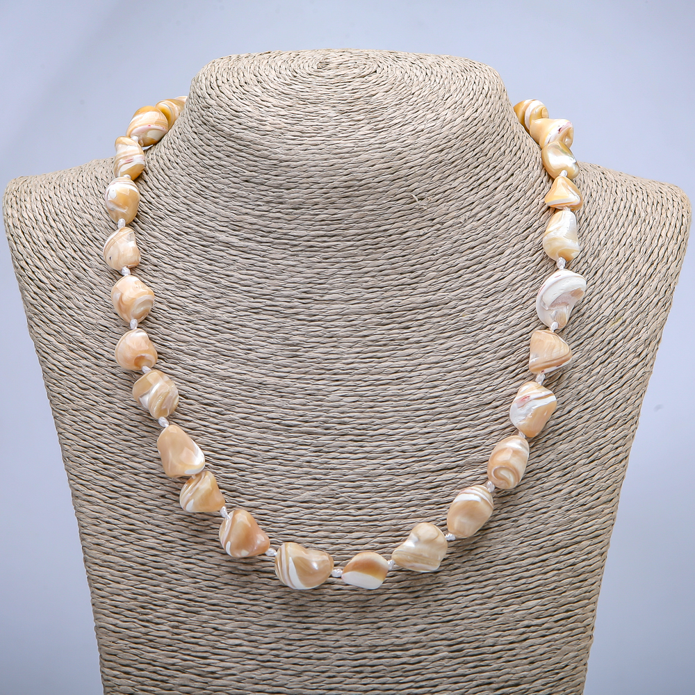 Natural beige mother-of-pearl necklace with texturing, bead size 19×12 mm, length 45 cm +/-